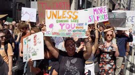 NYC Climate Strike: Marchers carry signs on Broadway