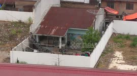 Home from hell! Indonesian home completely blocked off by hospital fence