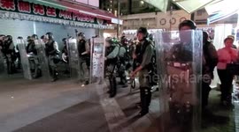 Hong Kong riot police move in on main road in Yuen Long after protest sit-in at nearby shopping mall