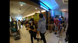 Pro-democracy Protesters invade a Starbucks calling to boycott the brand in Hong Kong