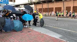 Hong Kong protesters take position behind wall of umbrellas ahead of confrontation with police