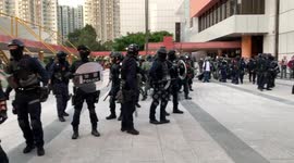 Hong Kong police storm shopping mall in Sha Tin