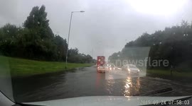 Flash flood leaves UK road deluged