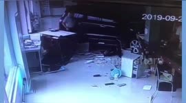 Car smashes into garage in China after driver presses accelerator by mistake