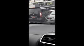 Driver spends more than 2 minutes attempting to reverse out of parking spot and fails miserably