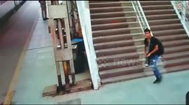 Alert cops save man from crushing death  in Indian railway station