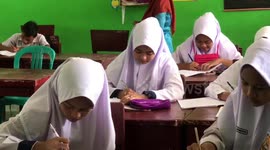 Students in Dharmasraya Regency, Indonesia return to school after week off due to haze