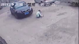 Boy's lucky escape after being run over and dragged by car