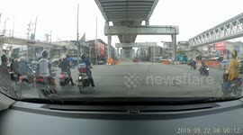 Motorcyclist in Bangkok pulls a wheelie through red light but face plants into the ground