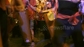 Drumming group play in the streets at the gracia festival in barcelona