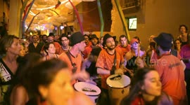 Drumming group play in the streets at the gracia festival in barcelona