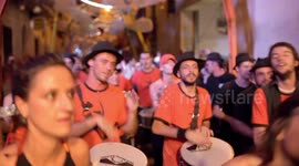 Drumming group play in the streets at the gracia festival in barcelona