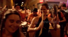 Drumming group play in the streets at the gracia festival in barcelona