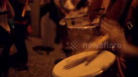Drumming group play in the streets at the gracia festival in barcelona