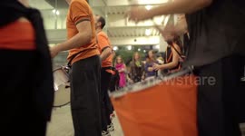 Drumming group play in the streets at the gracia festival in barcelona