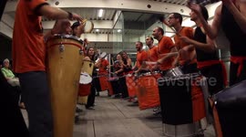 Drumming group play in the streets at the gracia festival in barcelona