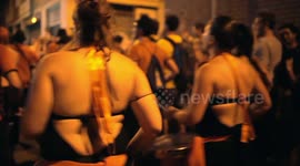 Drumming group play in the streets at the gracia festival in barcelona