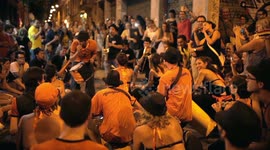 Drumming group play in the streets at the gracia festival in barcelona