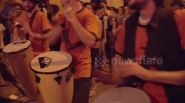 Drumming group play in the streets at the gracia festival in barcelona