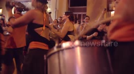 Drumming group play in the streets at the gracia festival in barcelona