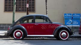 a sequence of 500 volkswagen beetle cars shot from the side in mexico