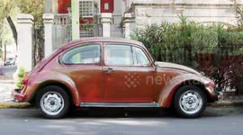 a sequence of 500 volkswagen beetle cars shot from the side in mexico