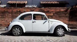 a sequence of 500 volkswagen beetle cars shot from the side in mexico