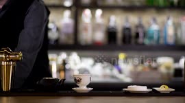 an experimental cocktail waiter makes a special drink in a bar lounge in spain