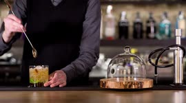an experimental cocktail waiter makes a special drink in a bar lounge in spain