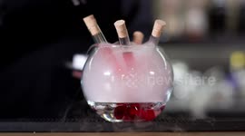 an experimental cocktail waiter makes a special drink in a bar lounge in spain