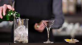 an experimental cocktail waiter makes a special drink in a bar lounge in spain