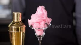 an experimental cocktail waiter makes a special drink in a bar lounge in spain