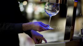 an experimental cocktail waiter makes a special drink in a bar lounge in spain