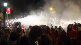 crowds in the street for the fire run or correfoc, during la merce festival, barcelona spain