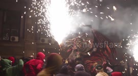 crowds in the street for the fire run or correfoc, during la merce festival, barcelona spain
