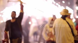 crowds in the street for the fire run or correfoc, during la merce festival, barcelona spain