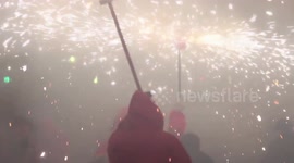crowds in the street for the fire run or correfoc, during la merce festival, barcelona spain