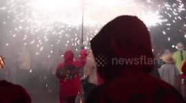 crowds in the street for the fire run or correfoc, during la merce festival, barcelona spain
