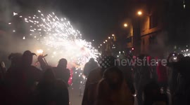 crowds in the street for the fire run or correfoc, during la merce festival, barcelona spain