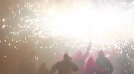 crowds in the street for the fire run or correfoc, during la merce festival, barcelona spain