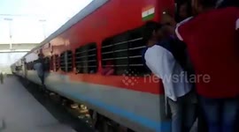 Man has a lucky escape after falling down from overcrowded coach of moving train