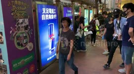Protesters stick posters on the floor near Admiralty