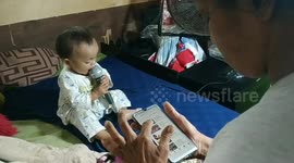 Funny one-year-old sings karaoke with her parents