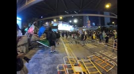 Protesters start requisitionning material from a construction site to build barricades on Harcourt road
