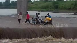 Locals in India rescue drunk biker from raging foodwaters