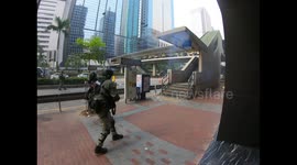Hong Kong riot police pull back as protesters hurl Molotov cocktails