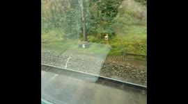 UK train slows to a crawl as floodwaters swamp tracks