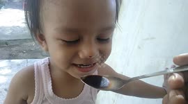 kids drink a black coffe. he like it very much