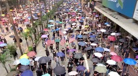 Hong Kong riot police storm area during peaceful protest march