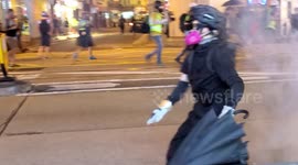 Hong Kong protesters retreat while under barrage of tear gas in Wan Chai